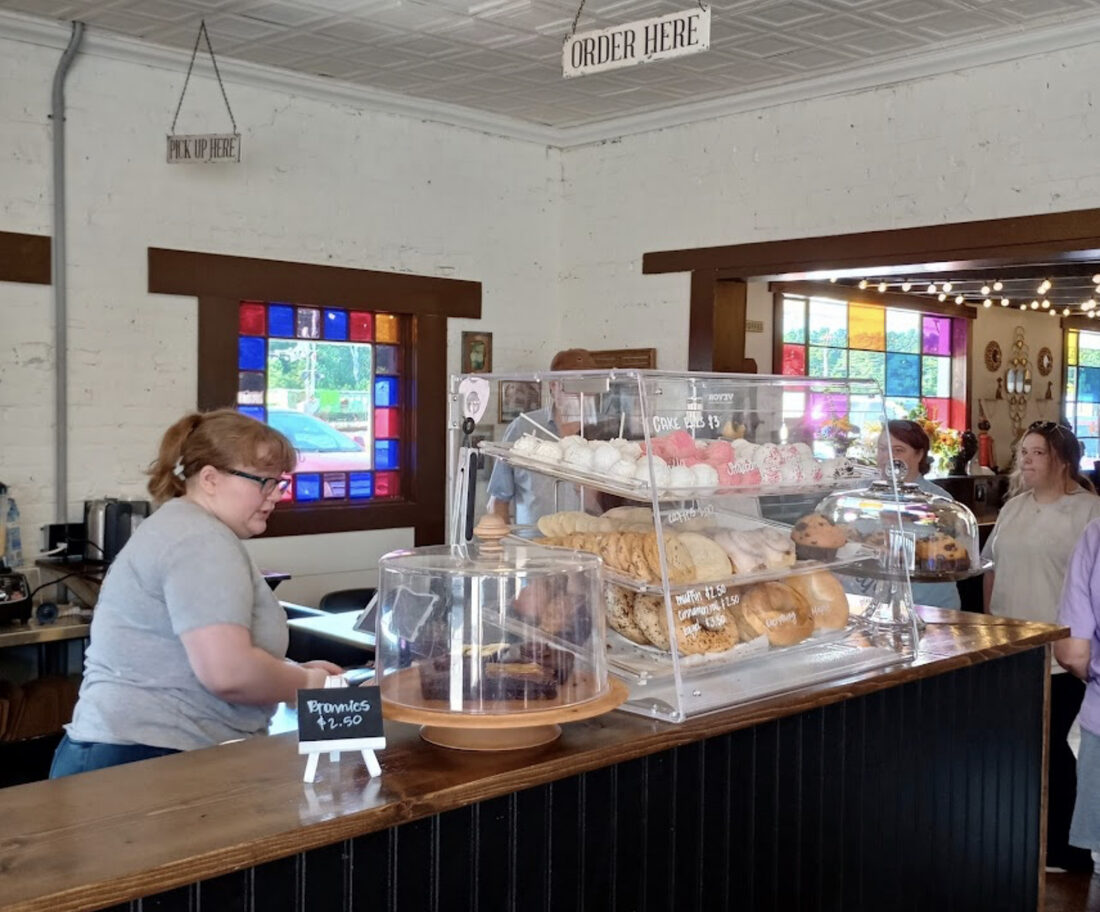 Pastry case and stained glass at Moody Cat Coffee Shop